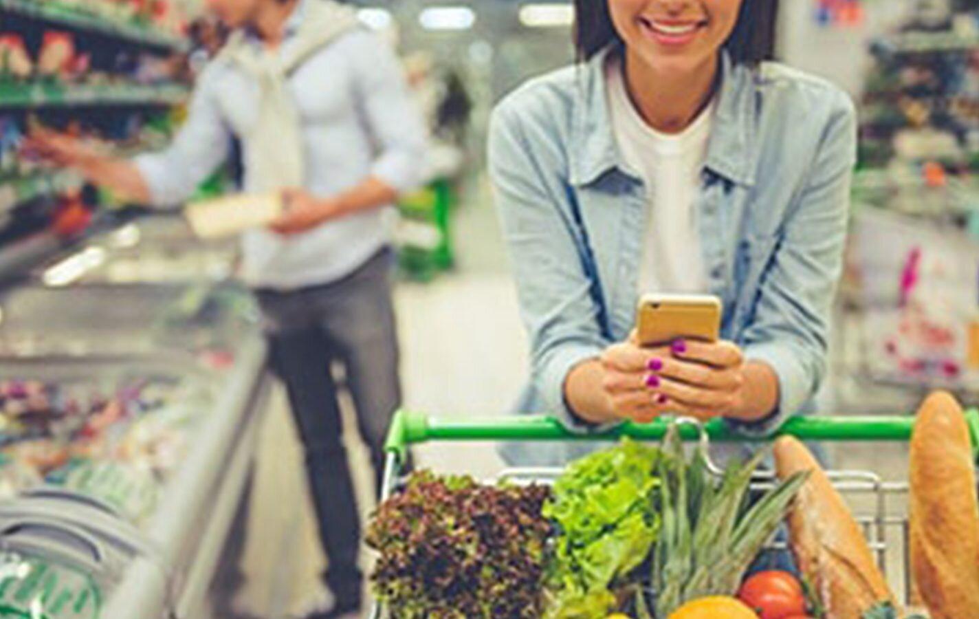 women in store with mobile